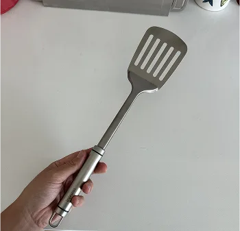 person holding titanimum pan 