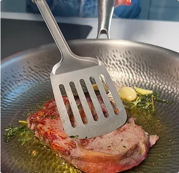 Person doing cooking with titanium pan 